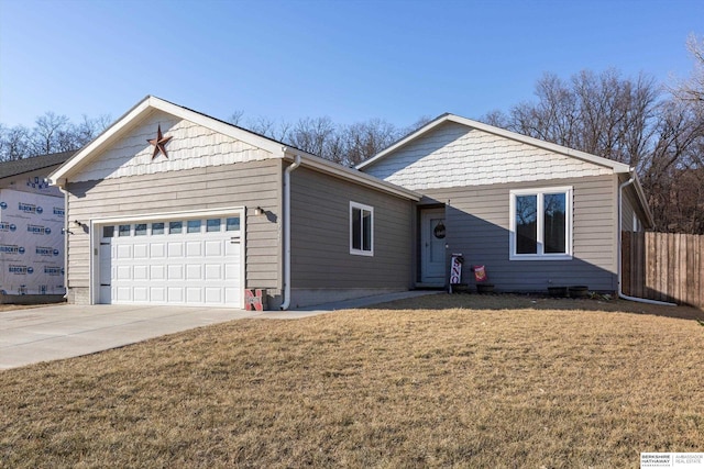 single story home with a garage and a front yard