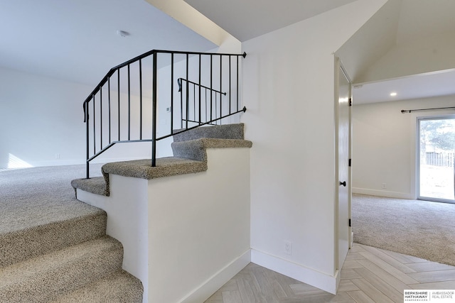 staircase with parquet flooring