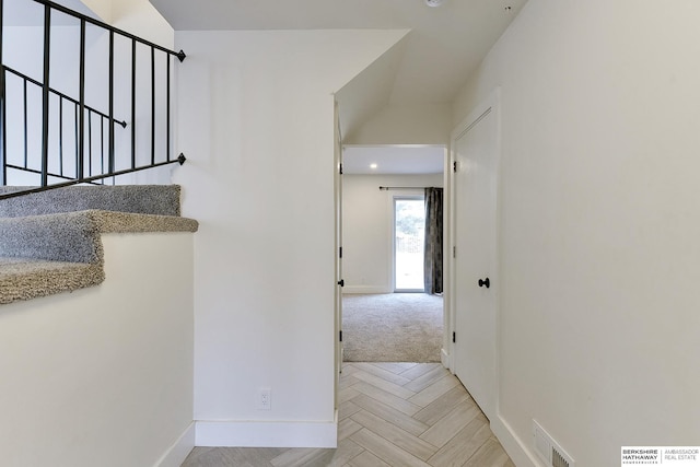 hallway featuring light parquet floors