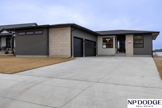 prairie-style home featuring a garage