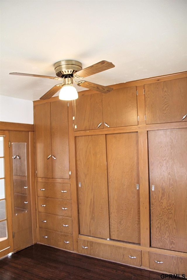 interior details with ceiling fan and wood-type flooring