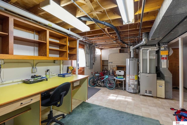 below grade area with light floors, water heater, electric panel, heating unit, and built in study area