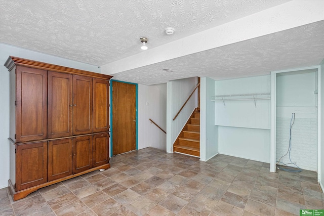 basement with a textured ceiling