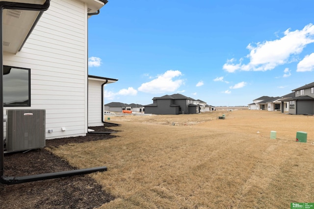 view of yard with central AC unit