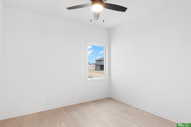 empty room with ceiling fan and light wood-type flooring