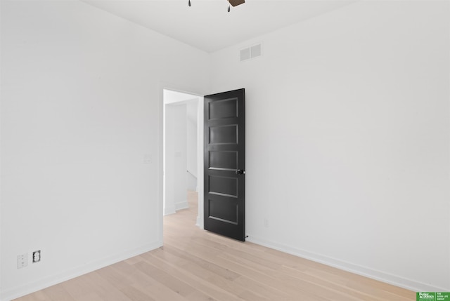 spare room with ceiling fan and light hardwood / wood-style floors