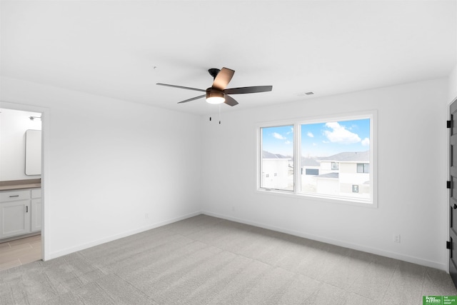 unfurnished room with light carpet and ceiling fan