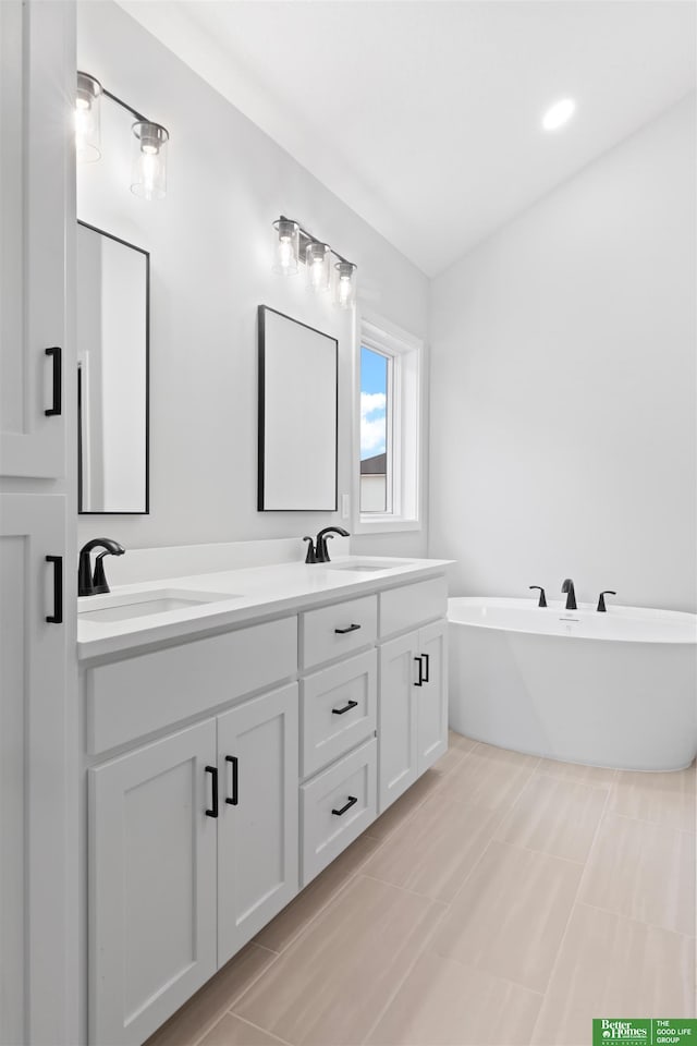 bathroom featuring vanity and a bathtub