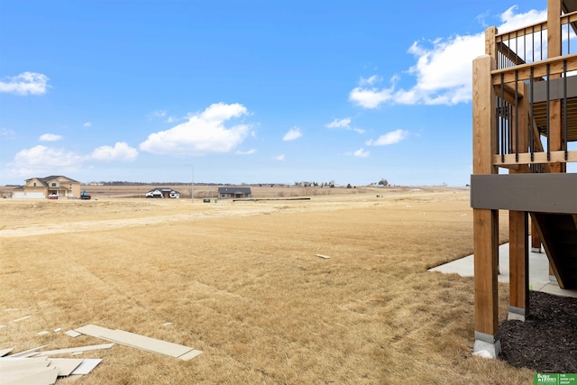 view of yard with a rural view