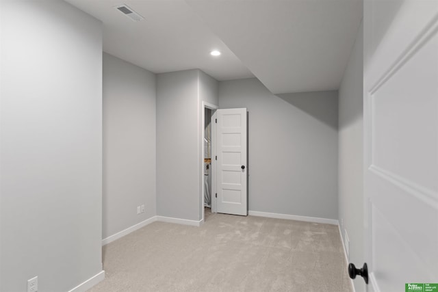 additional living space with light carpet