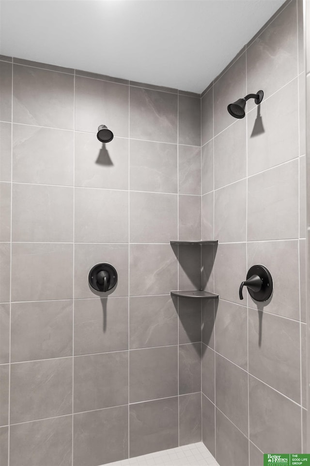 bathroom with tiled shower