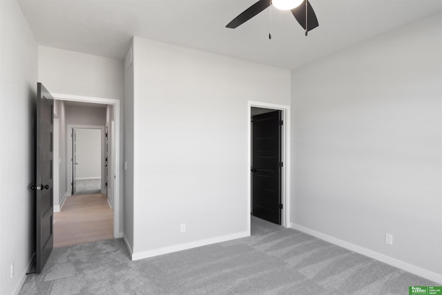 unfurnished bedroom with light carpet and ceiling fan