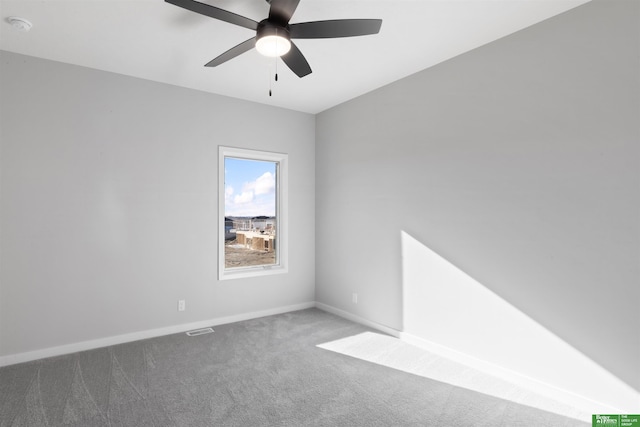 unfurnished room with carpet and ceiling fan