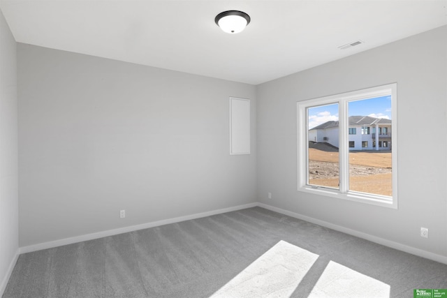 empty room featuring carpet flooring