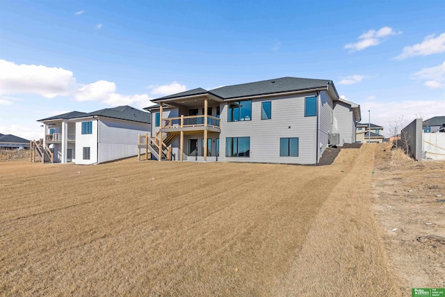 rear view of property featuring a yard