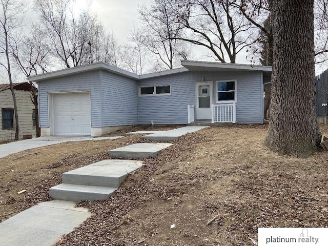 view of front of home featuring a garage and driveway