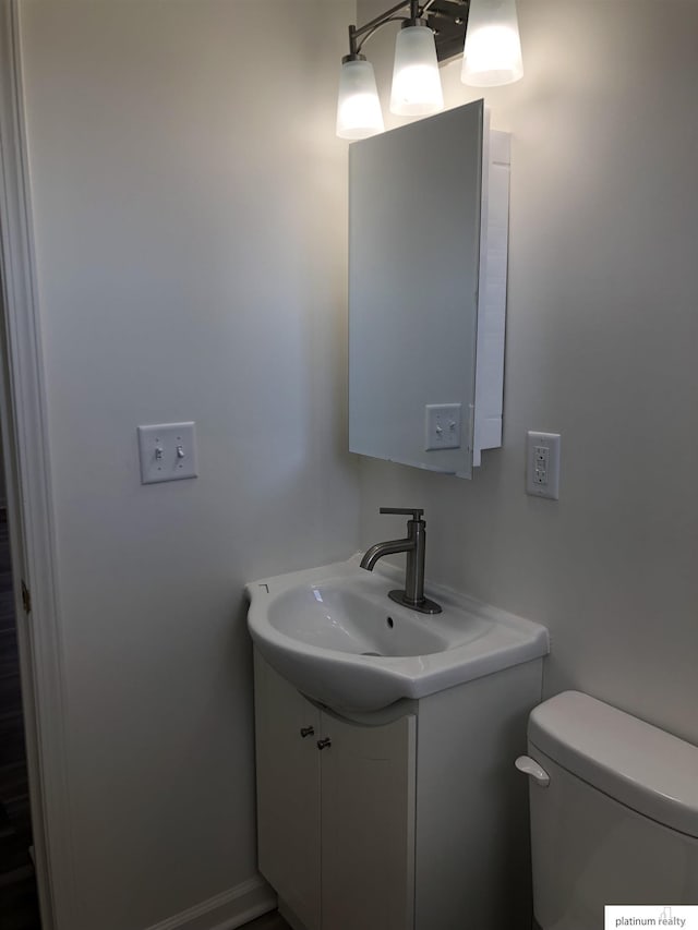 bathroom with vanity and toilet