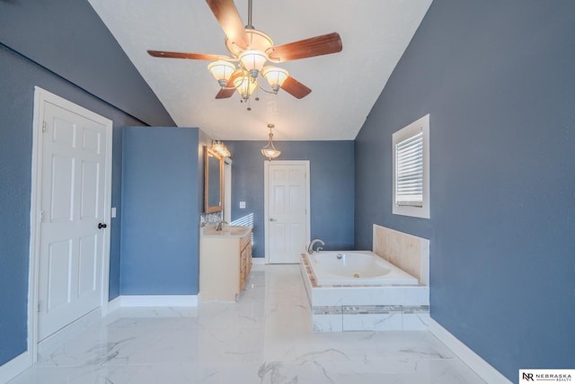 bathroom with vanity, a relaxing tiled tub, vaulted ceiling, and ceiling fan