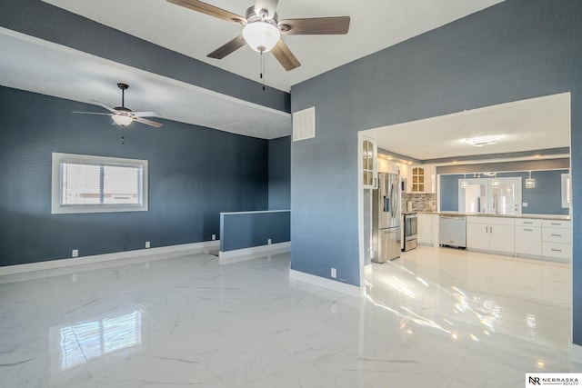 unfurnished living room featuring lofted ceiling and ceiling fan