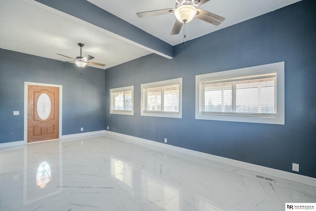 interior space with beamed ceiling and ceiling fan