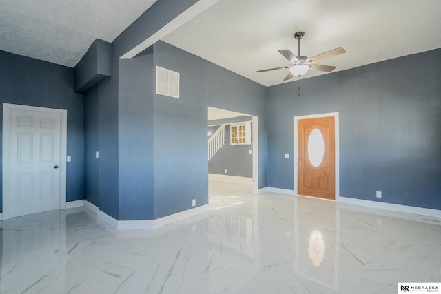 foyer featuring ceiling fan