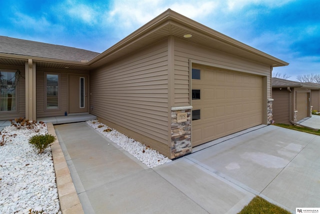 view of exterior entry featuring a garage