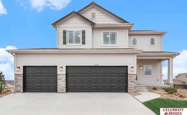 view of front of property with a garage and a porch