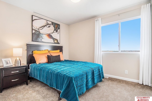 bedroom with light colored carpet