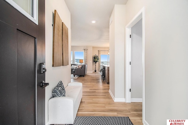 hall with light hardwood / wood-style flooring