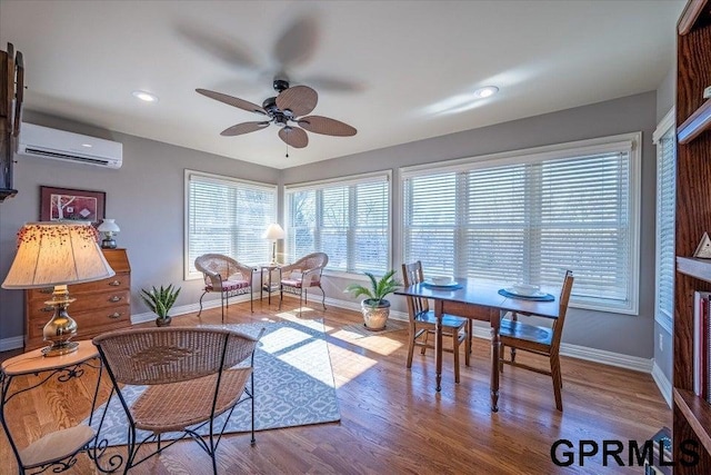 sunroom / solarium with ceiling fan and a wall mounted AC