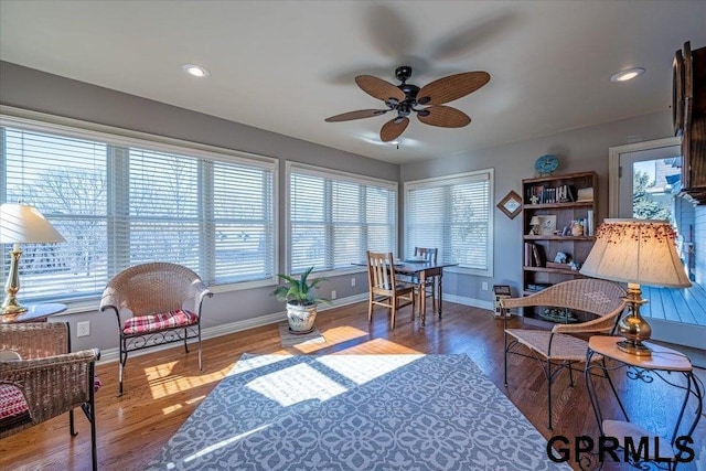 office space with ceiling fan, a healthy amount of sunlight, and dark hardwood / wood-style flooring