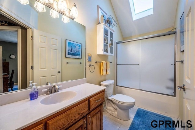 full bathroom featuring bath / shower combo with glass door, lofted ceiling with skylight, tile patterned flooring, vanity, and toilet