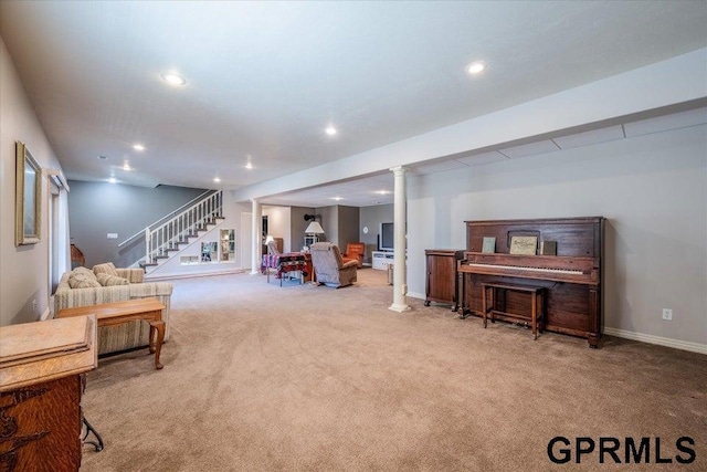 living room with decorative columns and carpet flooring