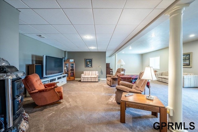 living room featuring ornate columns, carpet flooring, and a paneled ceiling