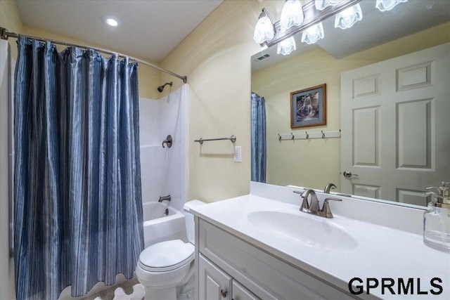 full bathroom featuring vanity, toilet, and shower / tub combo with curtain