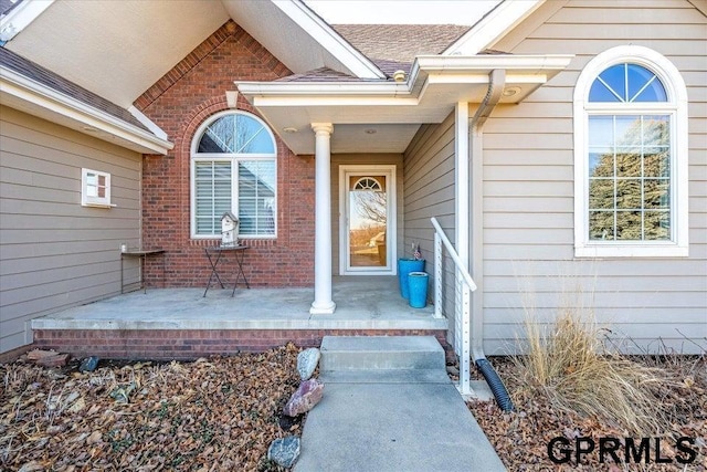 doorway to property with covered porch