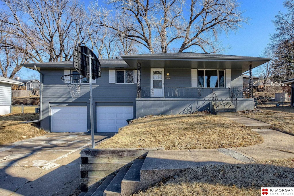 view of front of home featuring a garage and covered porch