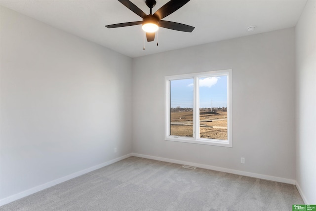 empty room with carpet flooring and ceiling fan