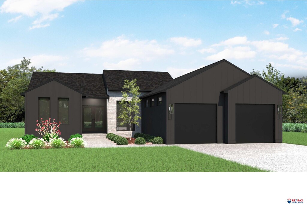 view of front facade with a garage and a front yard