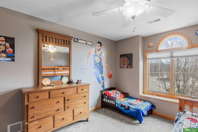 bedroom with light carpet and ceiling fan