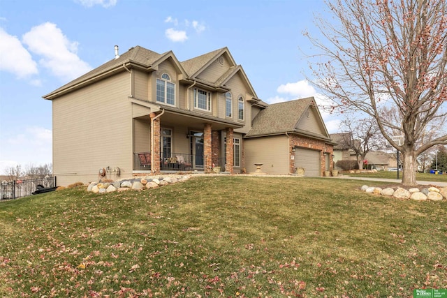 craftsman-style home featuring a porch, a garage, and a front yard