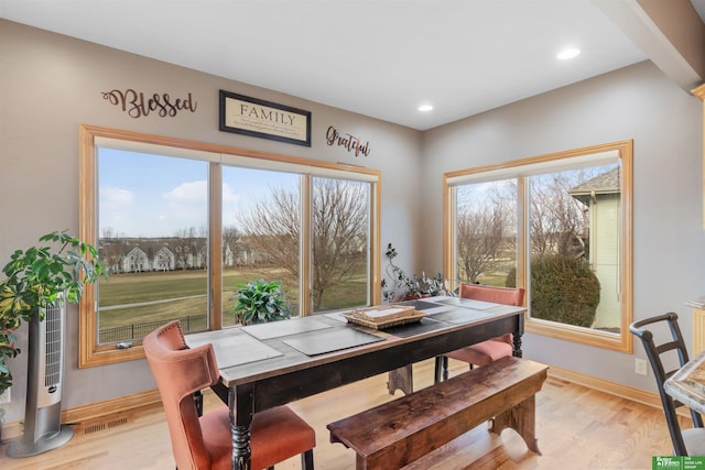 dining space with light wood-type flooring