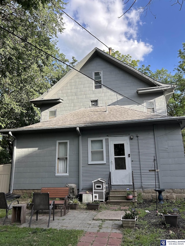 back of property with a patio area