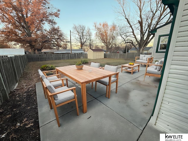 view of patio / terrace with an outdoor hangout area and a storage unit