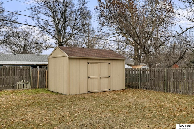 view of outbuilding with a lawn