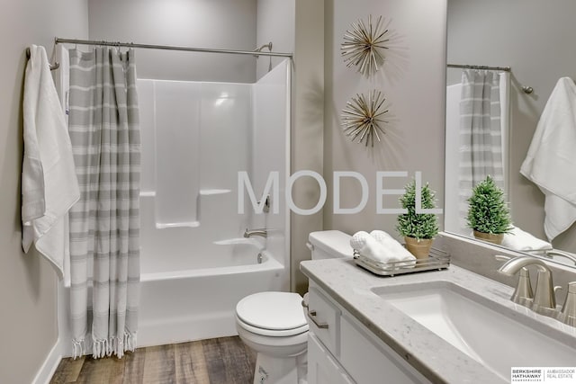 full bathroom with hardwood / wood-style flooring, vanity, toilet, and shower / bath combo with shower curtain