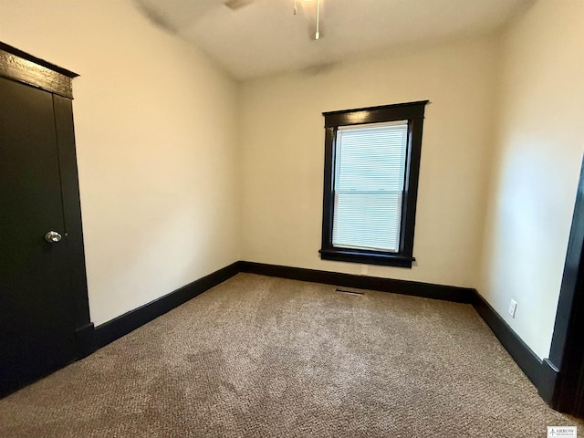 empty room with carpet flooring