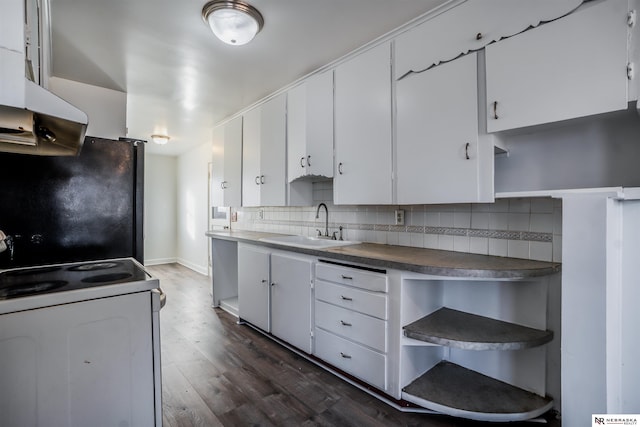 kitchen featuring sink, black refrigerator, white range with electric stovetop, white cabinets, and decorative backsplash