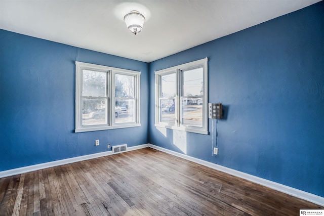 spare room featuring hardwood / wood-style flooring