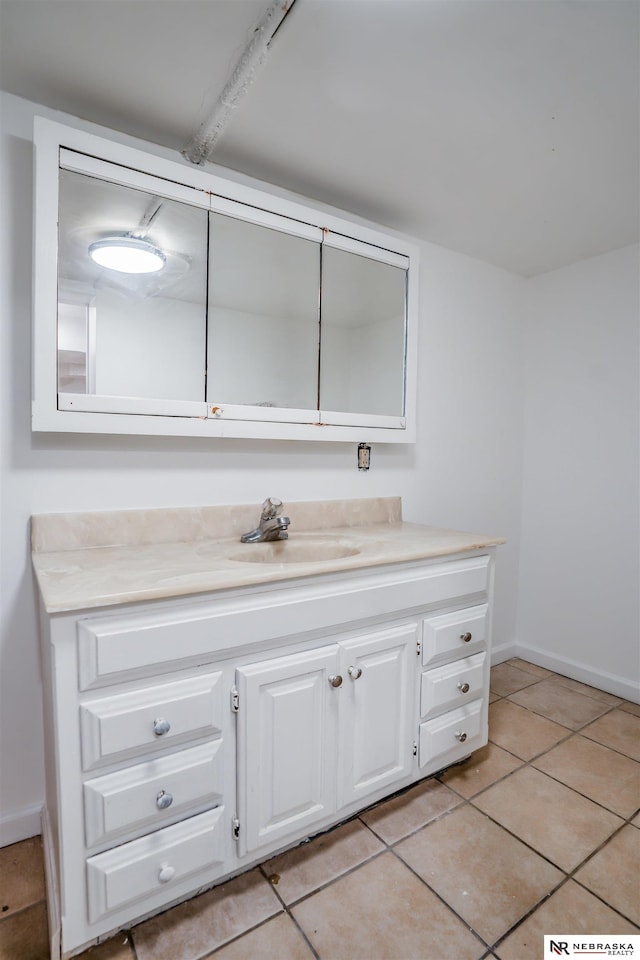 bathroom with vanity and tile patterned flooring